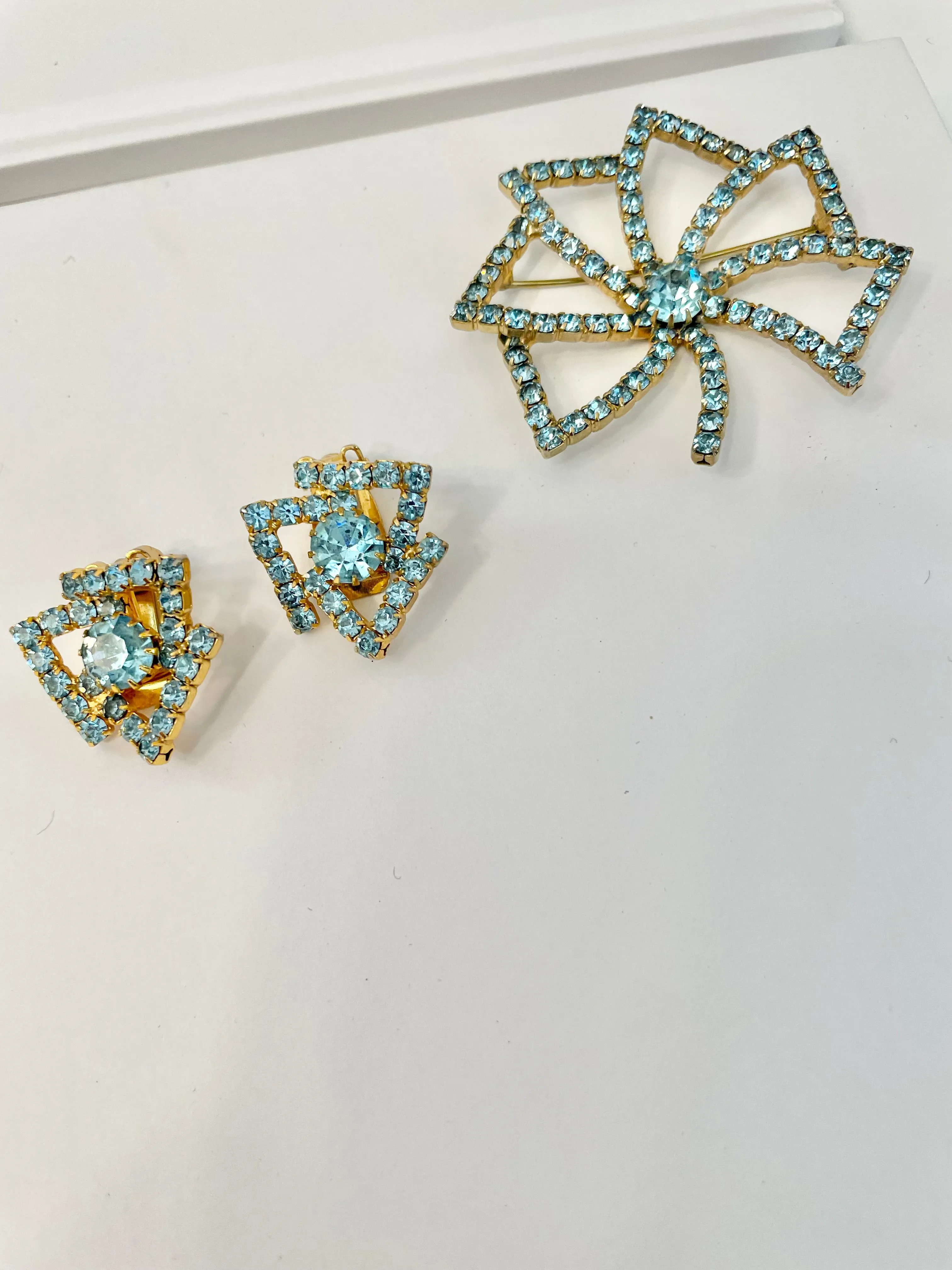 1960's Heiress and her love of a classy brooch set. This aqua glass brooch and earrings are truly divine.