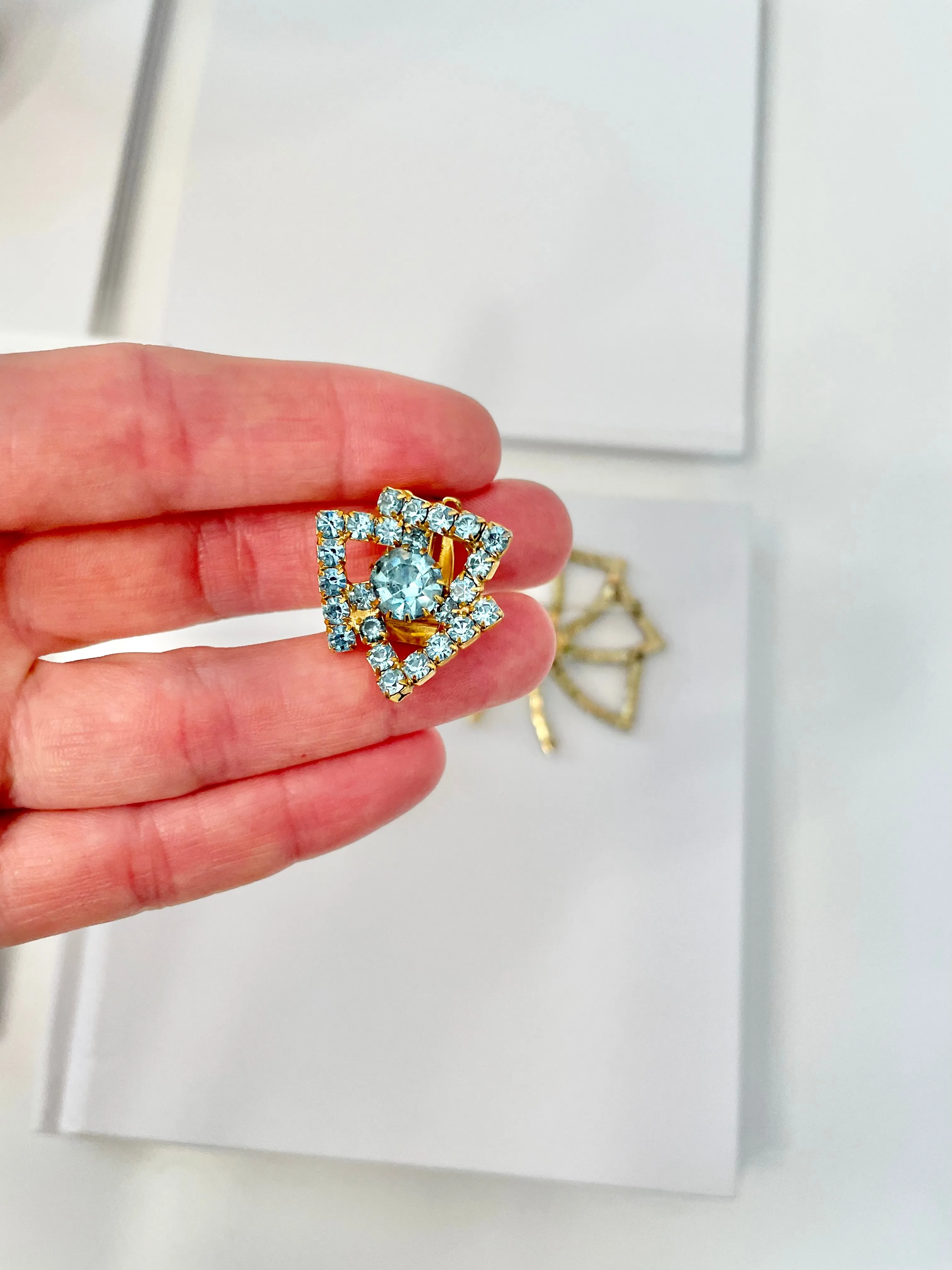 1960's Heiress and her love of a classy brooch set. This aqua glass brooch and earrings are truly divine.