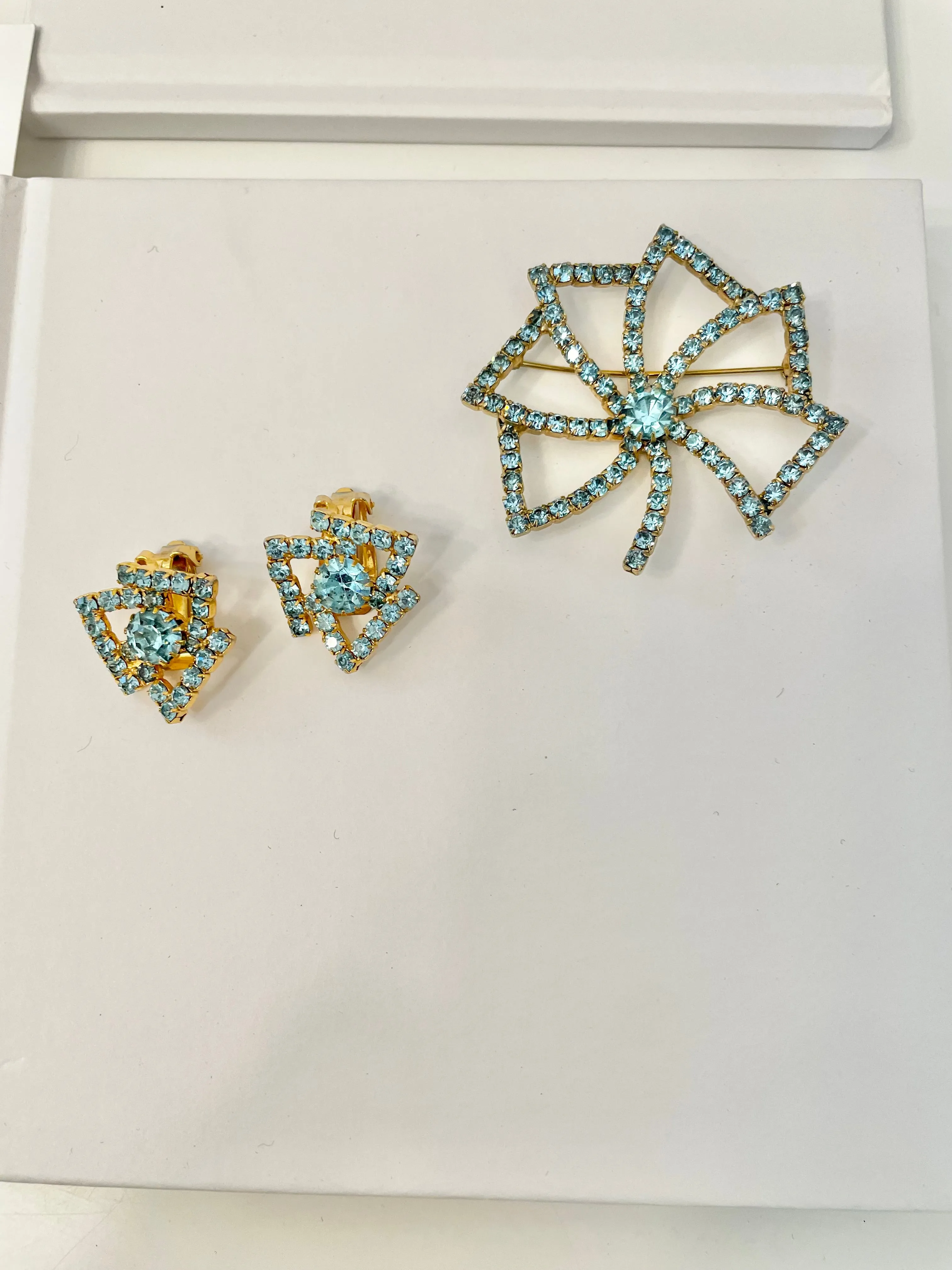 1960's Heiress and her love of a classy brooch set. This aqua glass brooch and earrings are truly divine.