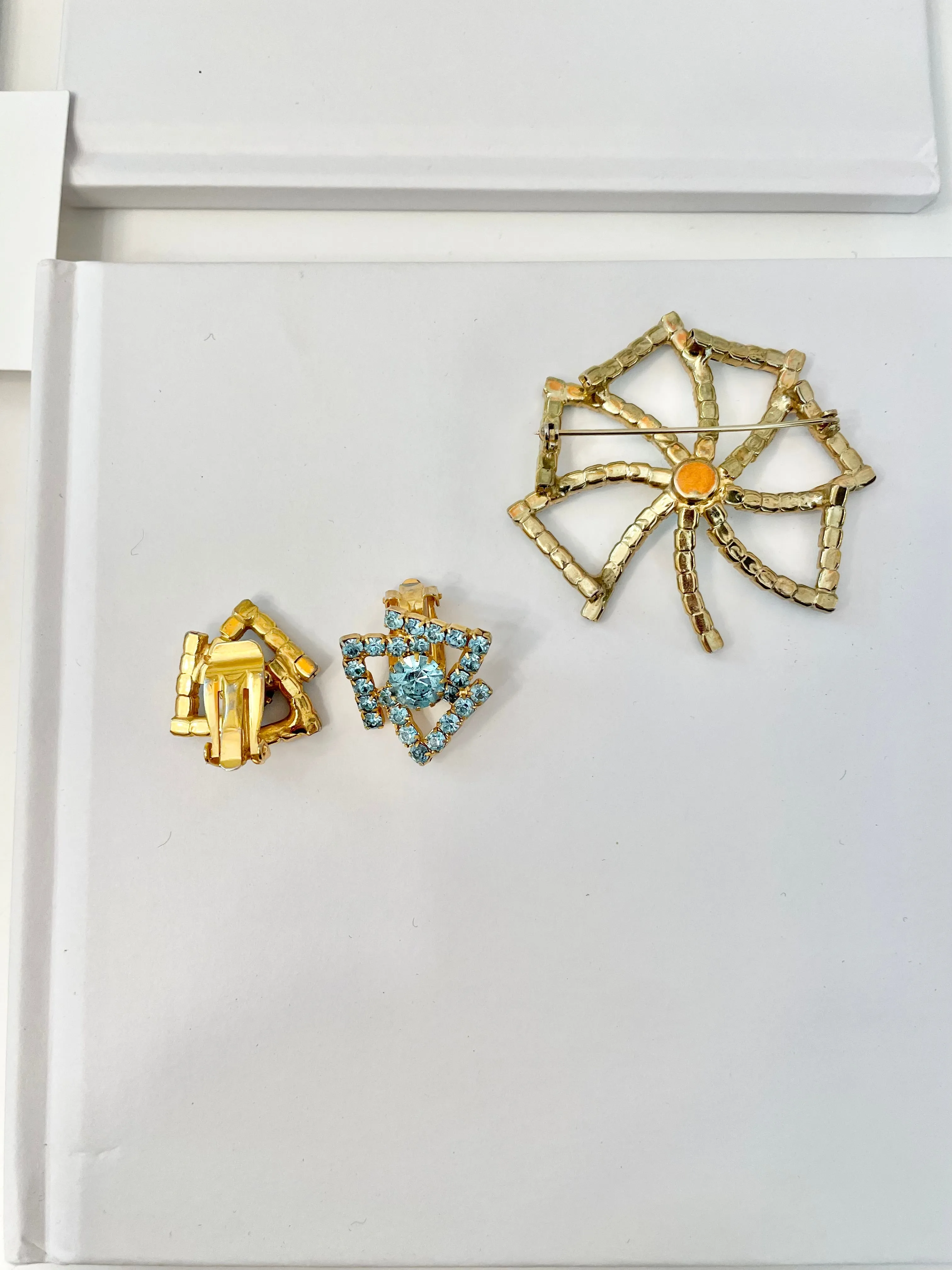 1960's Heiress and her love of a classy brooch set. This aqua glass brooch and earrings are truly divine.