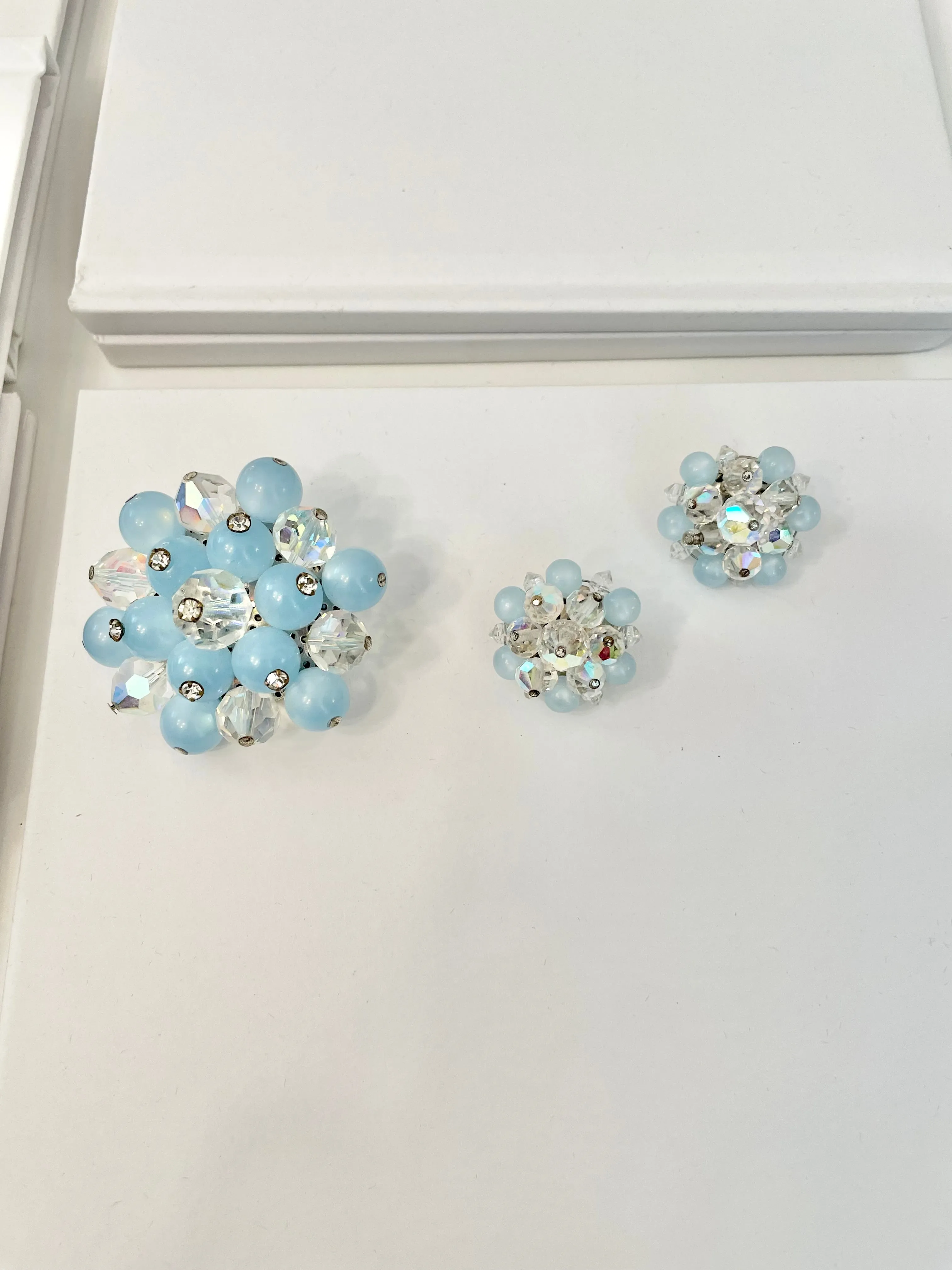 1960's Heiress and her love of the classic brooch, and matching earrings. Oh my! The soft blue with Austrian crystals is truly divine.