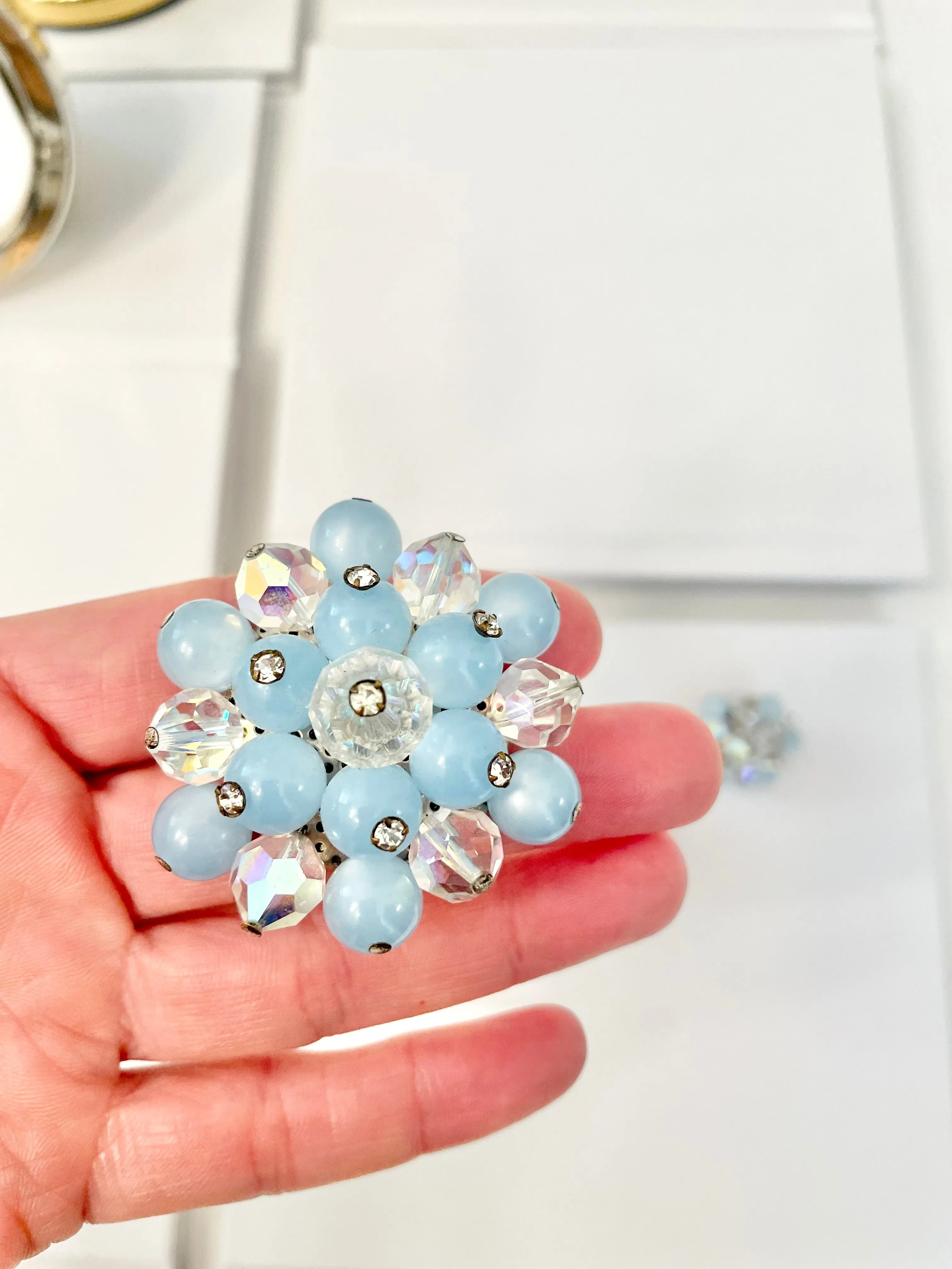 1960's Heiress and her love of the classic brooch, and matching earrings. Oh my! The soft blue with Austrian crystals is truly divine.