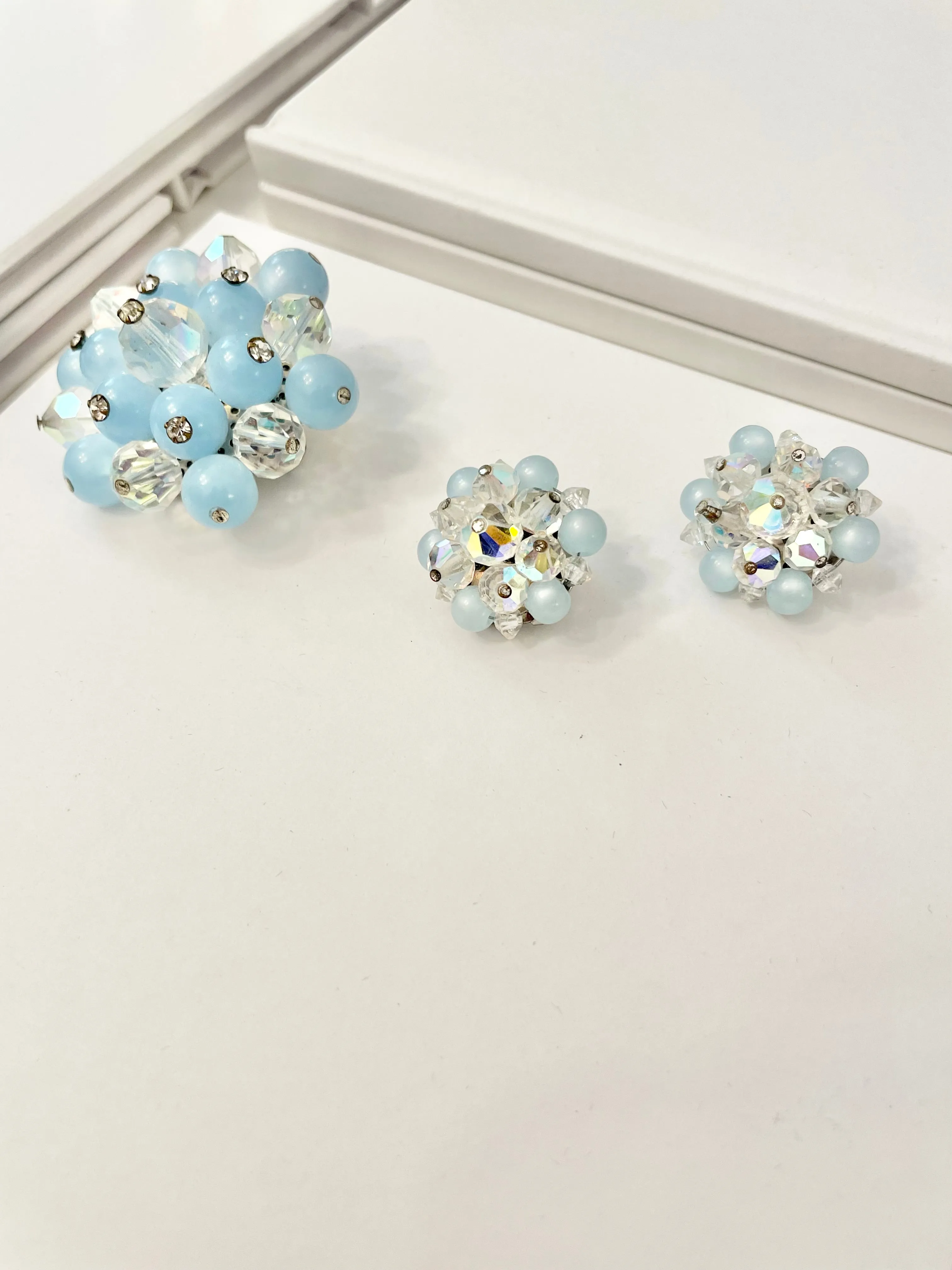 1960's Heiress and her love of the classic brooch, and matching earrings. Oh my! The soft blue with Austrian crystals is truly divine.