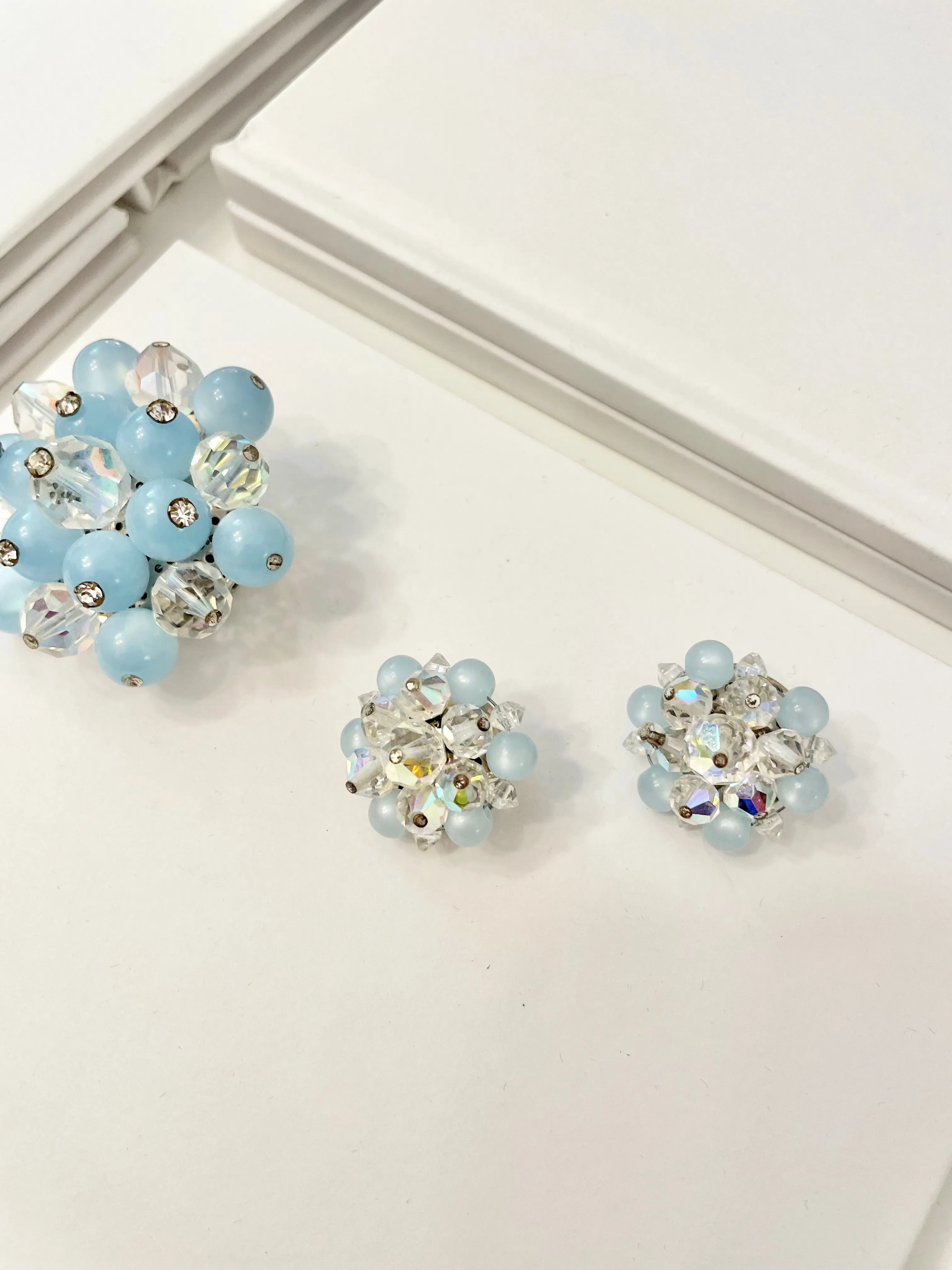 1960's Heiress and her love of the classic brooch, and matching earrings. Oh my! The soft blue with Austrian crystals is truly divine.