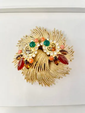 A beautiful rich gold brooch, adorned with the most exquisite color story, coral, green, and carnelian! so chic