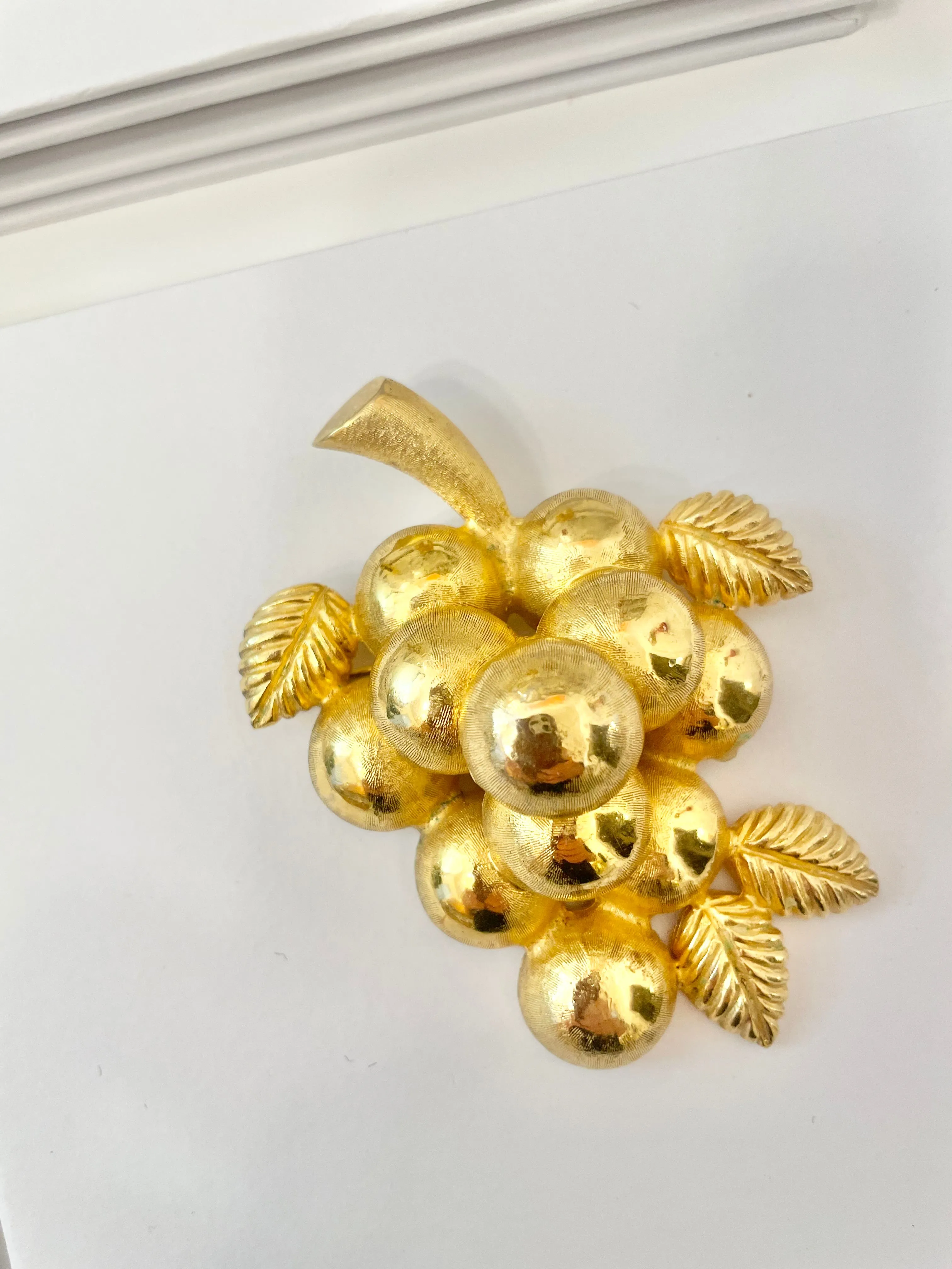 A truly special piece... a rare Judith Leiber heavy gold, sculptural brooch... So chic!