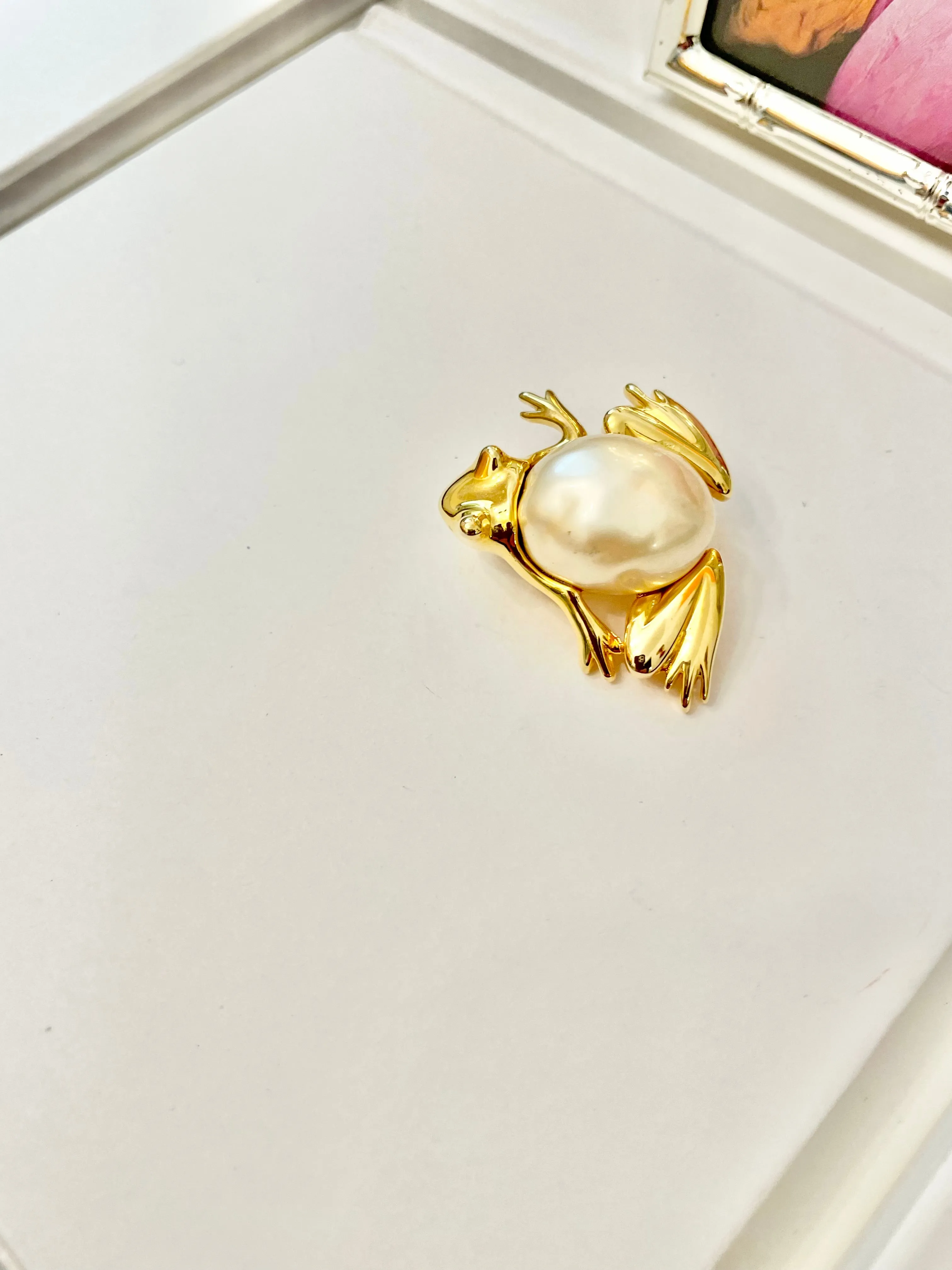 The charming lady loves anything with pearls. This Kenneth Jay lane figural gold brooch is truly divine!