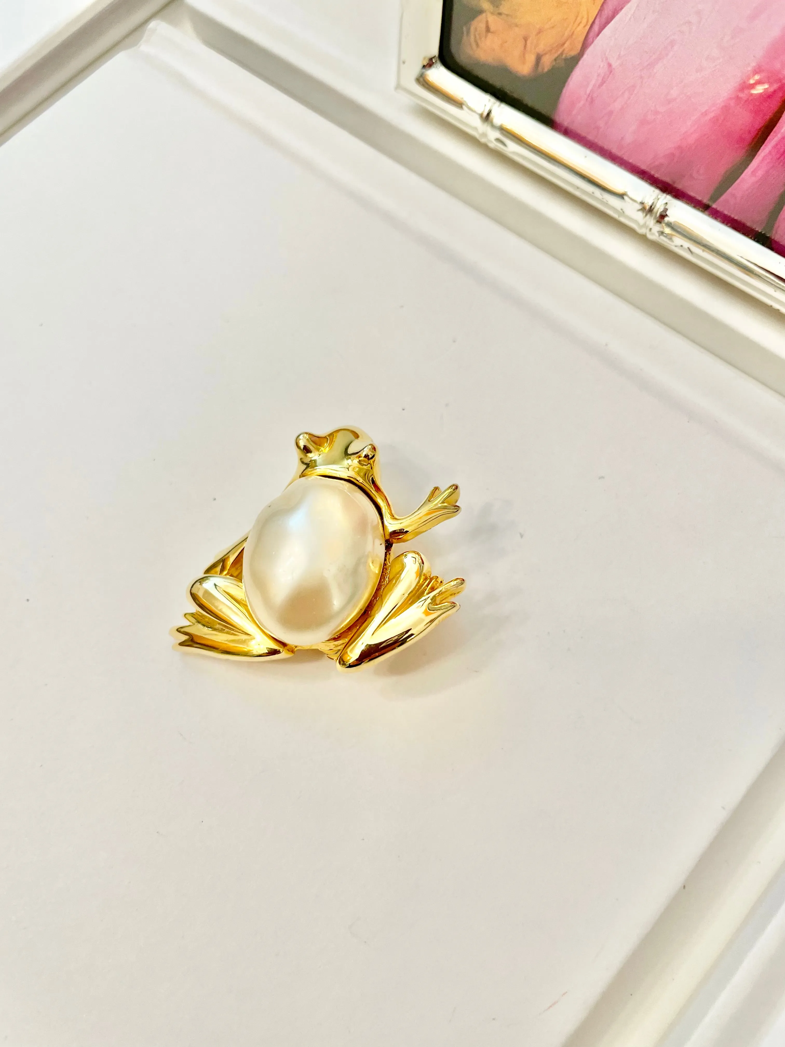 The charming lady loves anything with pearls. This Kenneth Jay lane figural gold brooch is truly divine!