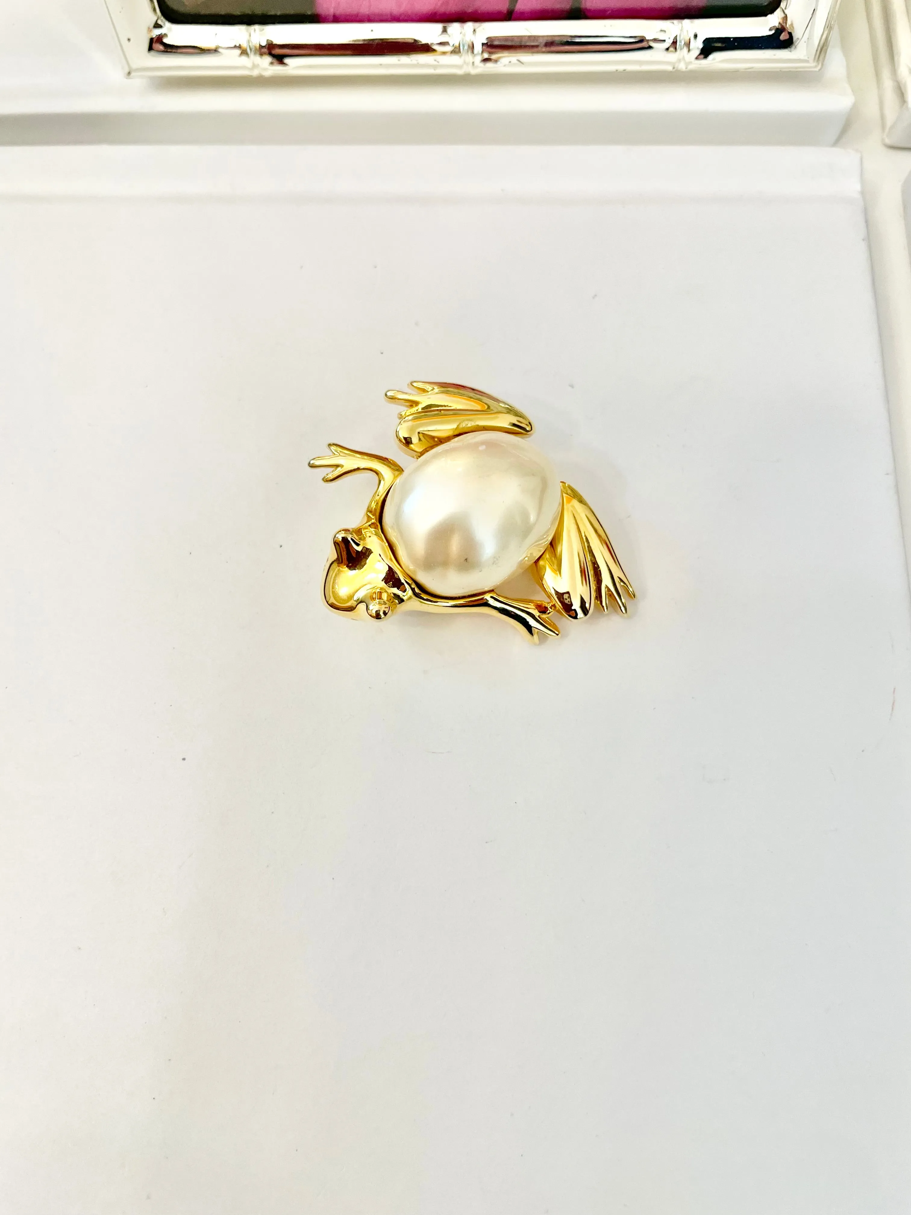 The charming lady loves anything with pearls. This Kenneth Jay lane figural gold brooch is truly divine!