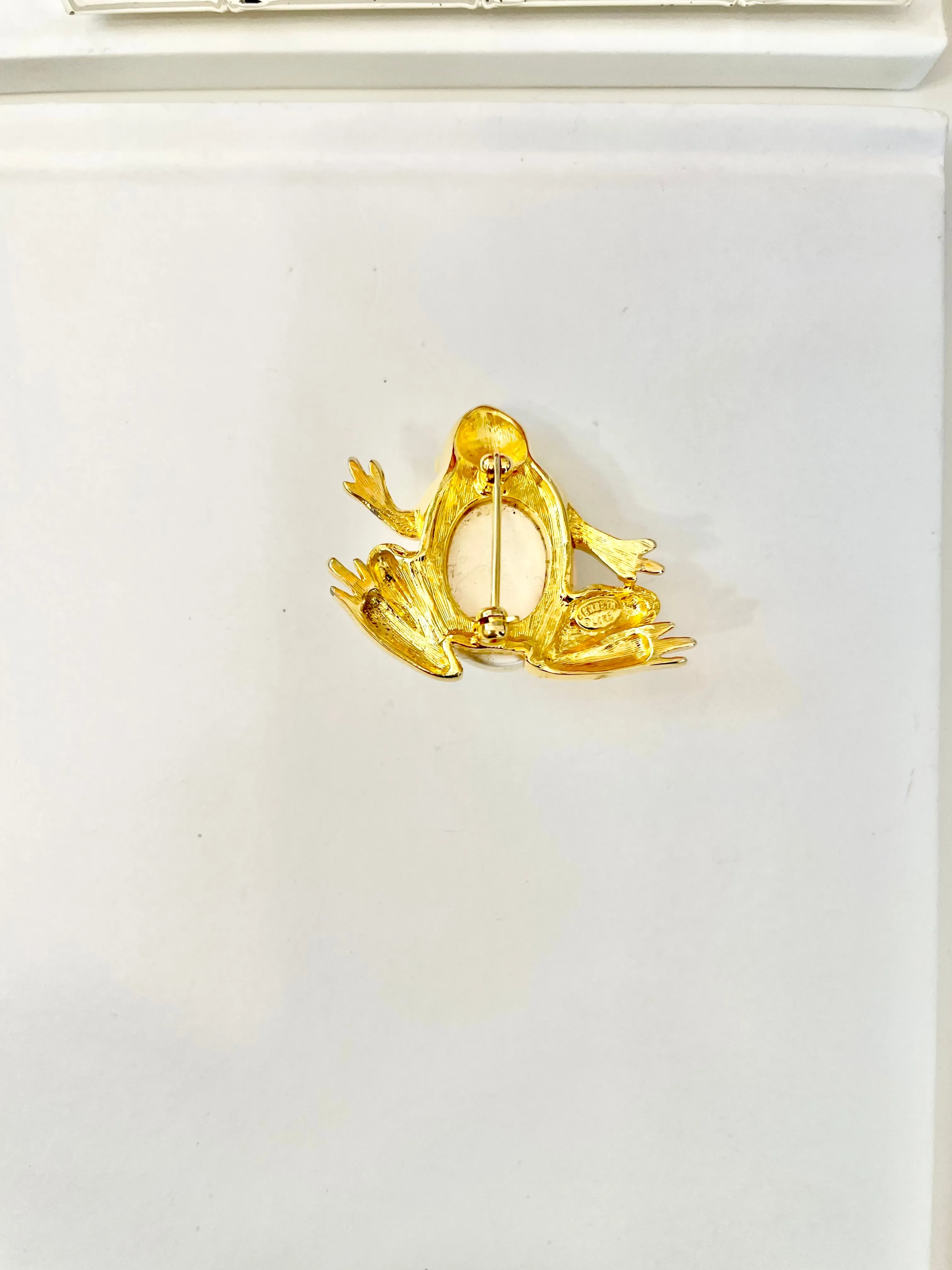 The charming lady loves anything with pearls. This Kenneth Jay lane figural gold brooch is truly divine!