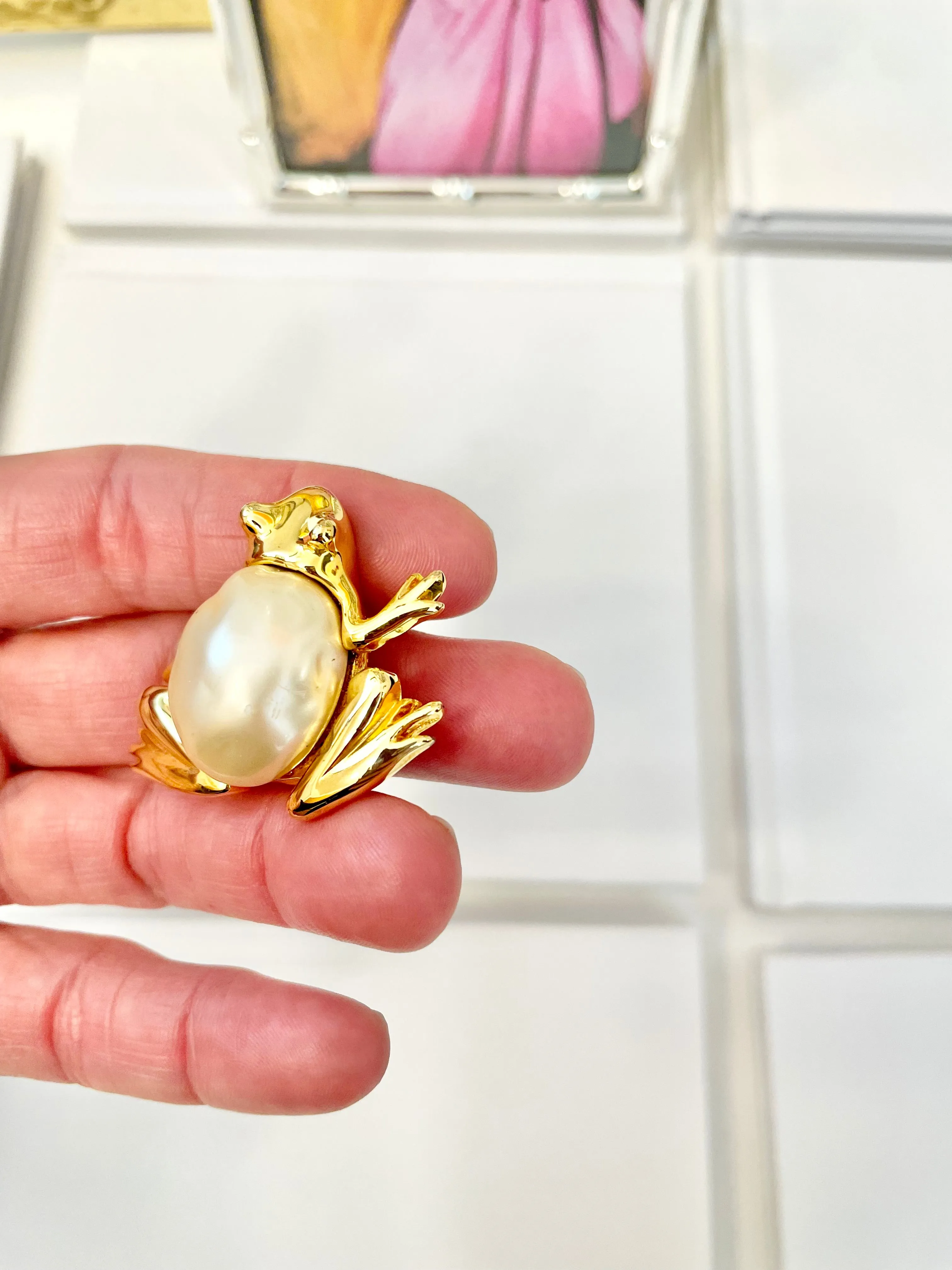 The charming lady loves anything with pearls. This Kenneth Jay lane figural gold brooch is truly divine!