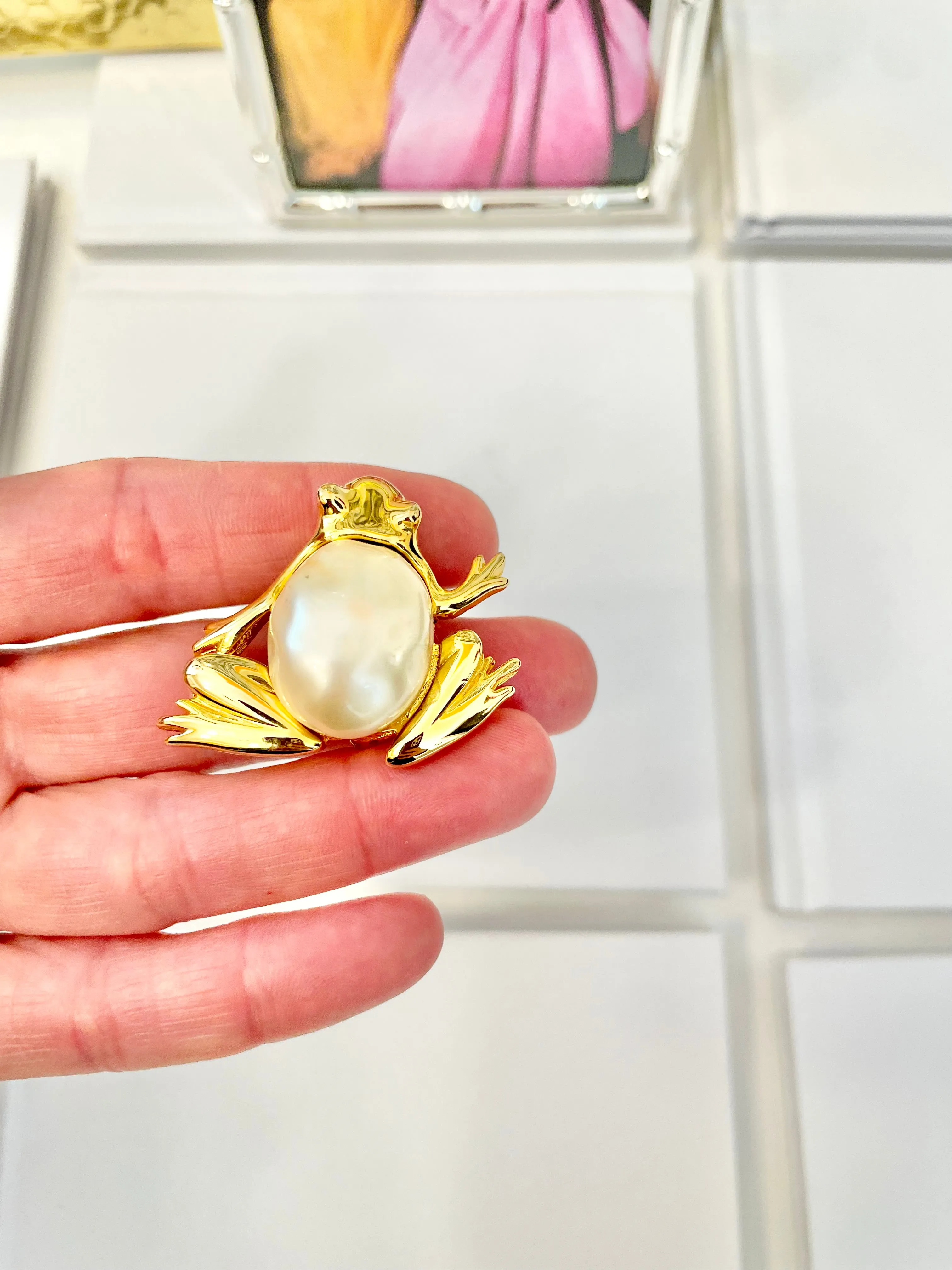 The charming lady loves anything with pearls. This Kenneth Jay lane figural gold brooch is truly divine!