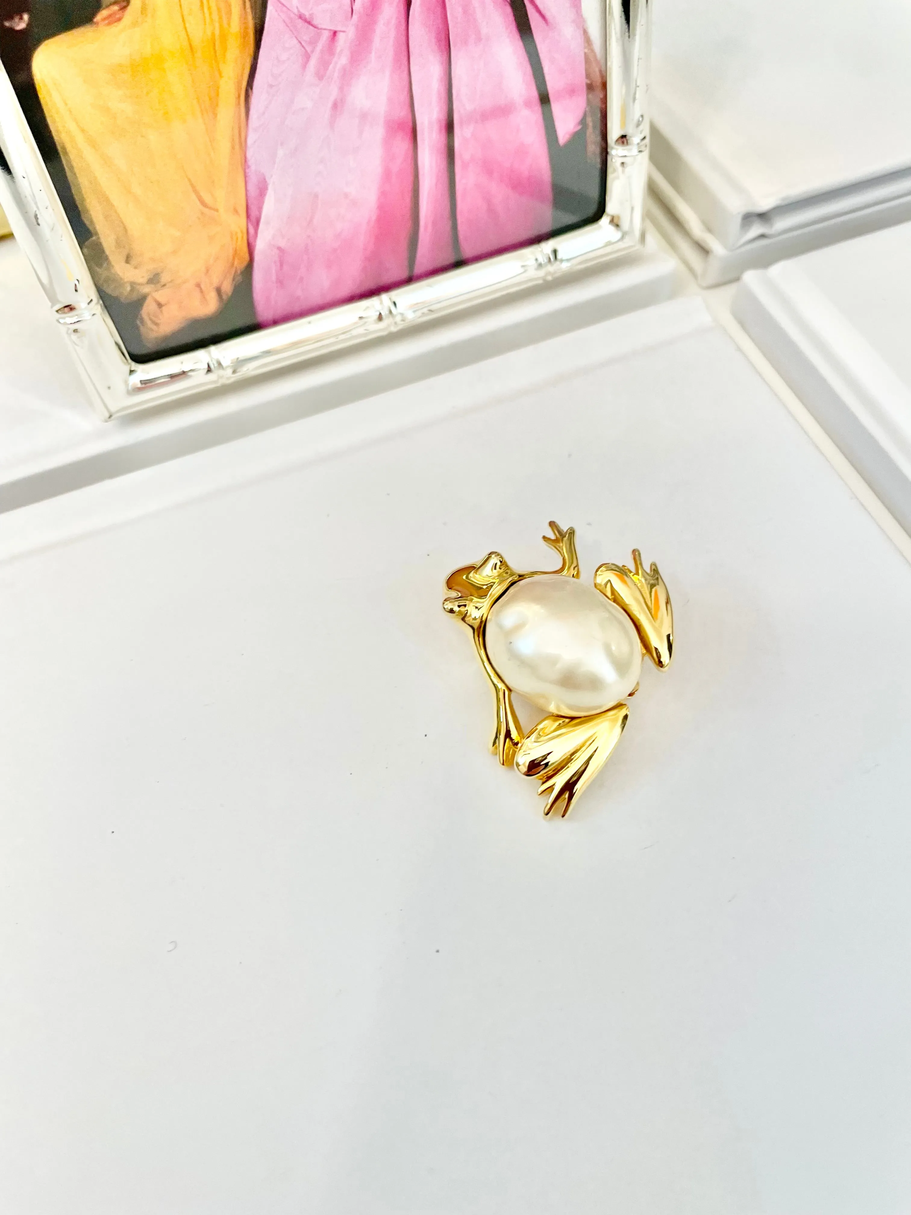 The charming lady loves anything with pearls. This Kenneth Jay lane figural gold brooch is truly divine!